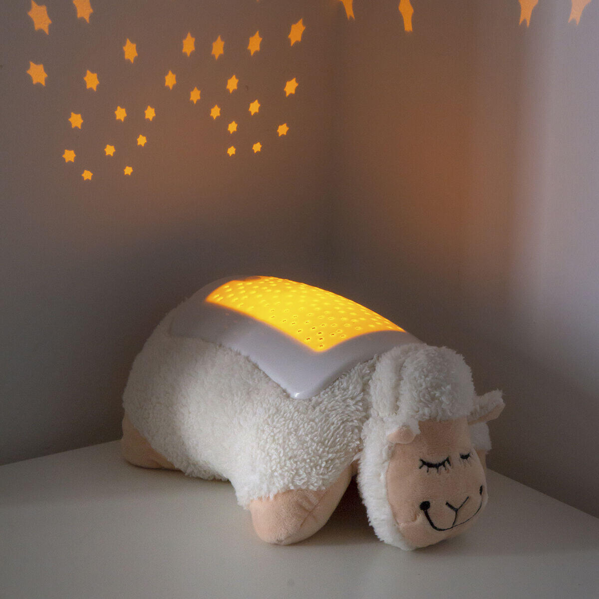 peluche con proyector de luces