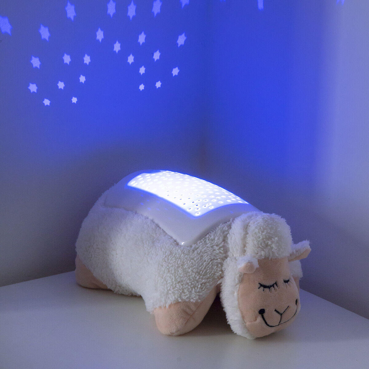 peluche con proyector de luces